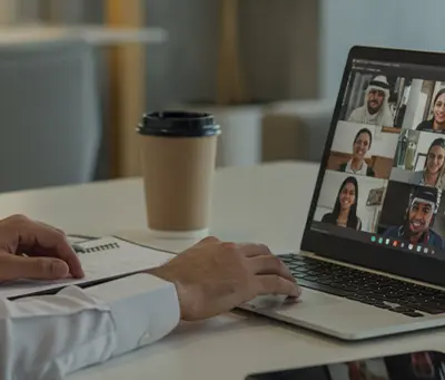 person-video-conference-laptop-notepad-coffee.